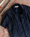 The Button Down Polo in Dark Navy Stripe